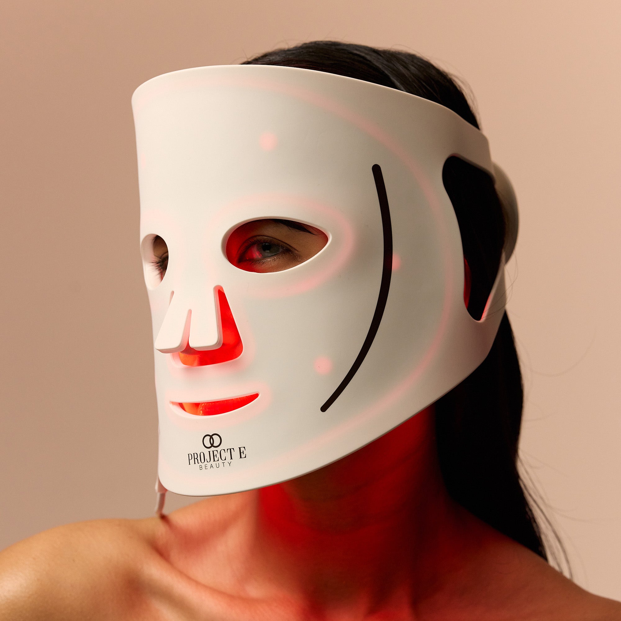 Female enhancing skin rejuvenation with red light therapy.